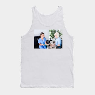 Nurse caring for senior woman (F034/9359) Tank Top